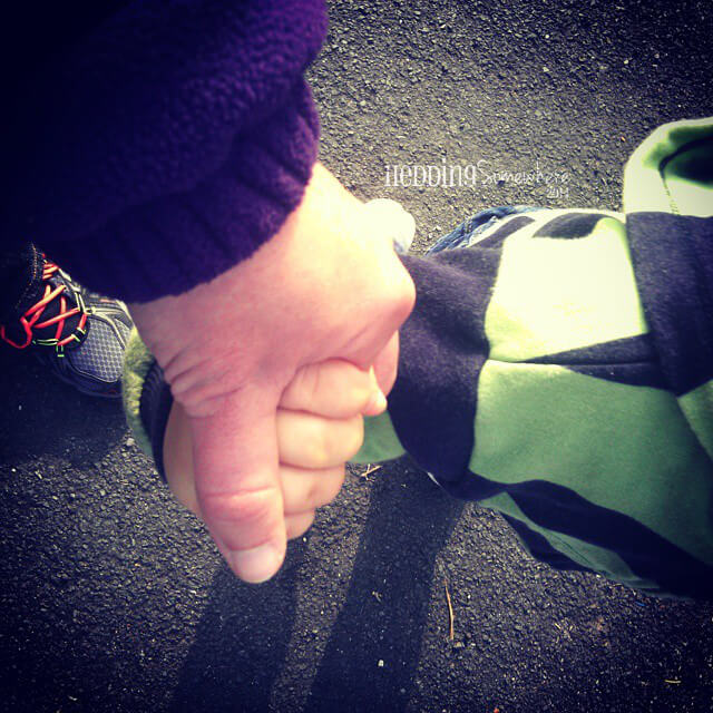 gaining perspective - Asher & Mum hold hands